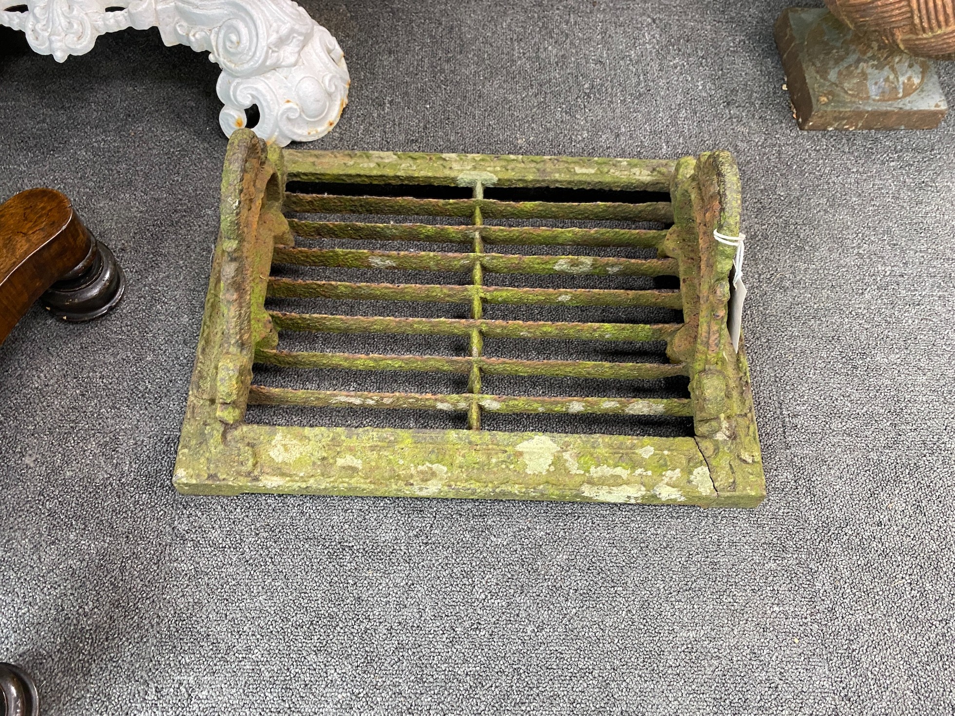A Victorian cast iron boot scraper, width 46cm, depth 33cm